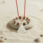 Shri Surya Yantra Silver Locket and Wood & Clear Crystal Bracelet Combo Front